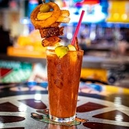 A 22 Ounce Bloody Mary Topped with Grilled Cheese, Wings and More Kicks Off Football Promos at Sickies Garage