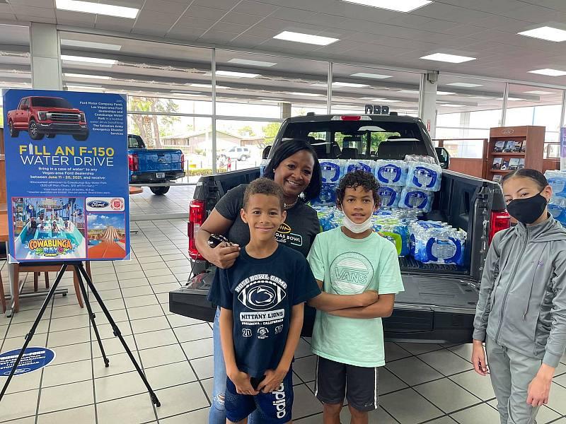  Ford dealerships collected cases of water to support The Salvation Army 