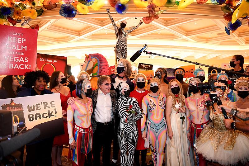 “O” by Cirque du Soleil cast and crew members delight guests at Bellagio as they parade through the resort on reopening night in Las Vegas, July 1, 2021