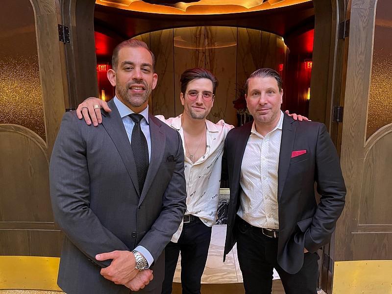 Logan Henderson from the boy band Big Time Rush poses with Barry’s Downtown Prime Co-owners Yassine Lyoubi and Marco Cicione