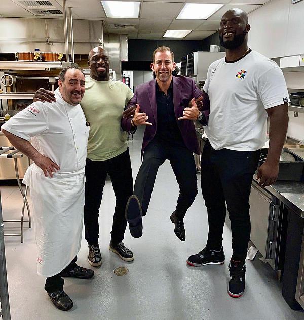 WWE Stars Titus O’Neil and Omos in the Kitchen at Barry’s Downtown Prime with Celebrity Chef Barry and joking around with co-owner Yassine Lyoubi 
