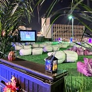 Hidden Cinema Rooftop Garden Shows Classic Holiday Movies, Offers Themed Photo Booth