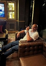 Charles Barkley Chills Out with a Cigar and Tequila at Eight Lounge in Las Vegas