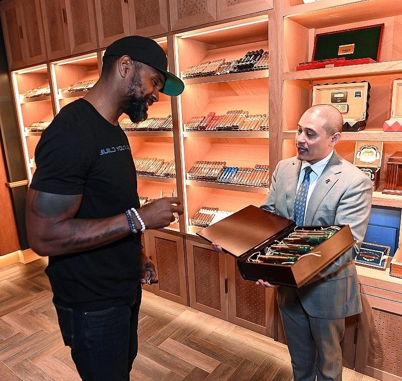 Eight Lounge - Charles Woodson in humidor with Ian Floranza - Photo credit: Toby Acuna