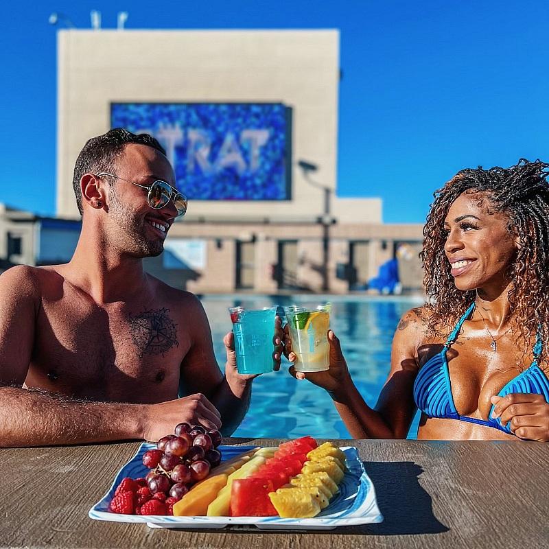 Guests Enjoying Poolside Cocktails and Bites at The STRAT