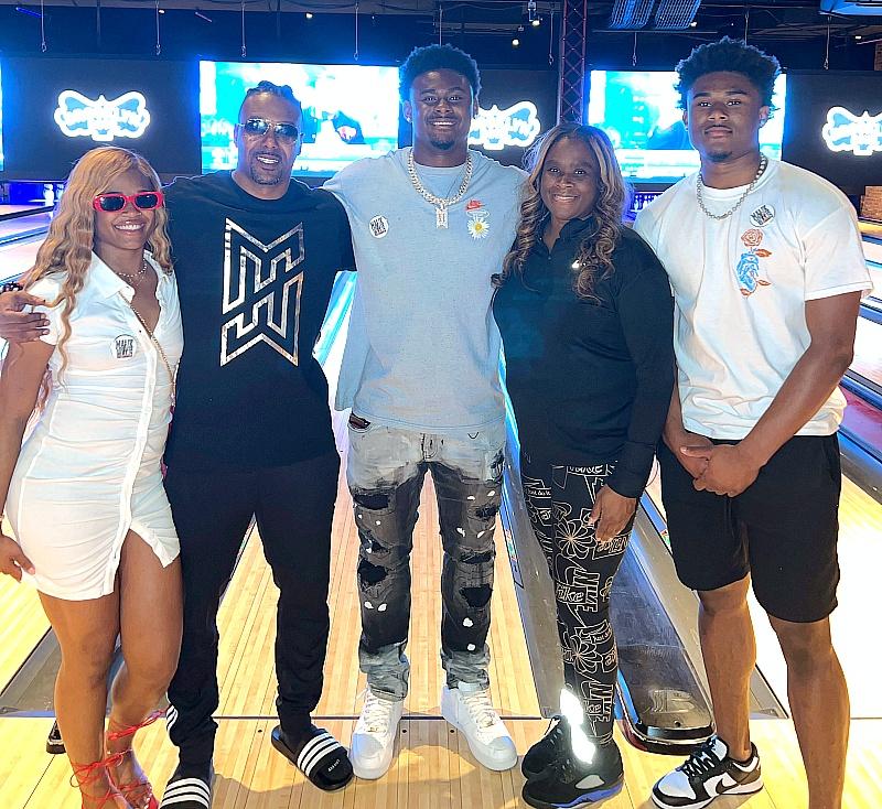 Malik Willis (R) with friends and family