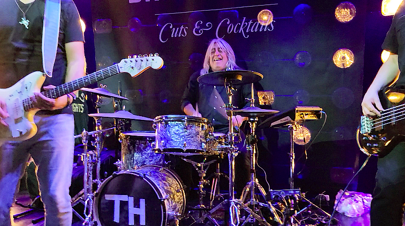 Last night, superstar musician Mikkey Dee of the iconic rock band Scorpions made a surprise appearance at The Barbershop Cuts & Cocktails at The Cosmopolitan of Las Vegas following the band’s concert at Zappos Theater.  The acclaimed drummer was joined by a group of friends shortly before 1 a.m., enjoying a mix of Budweiser and Veuve Clicquot as he mingled and took pictures with fans. Jovial in manner and enjoying the music, Dee even hopped on stage to help perform “Tush” by ZZ Top with featured band The Commonwealth to a crowd of ecstatic fans. He stayed until closing time to take a moment to chat with the band, and upon his deperature, noted he enjoyed the evening and will be visiting again soon.  The Barbershop continues to be popular spot for superstar artists like Machine Gun Kelly, Zac Brown, Gavin DeGraw and Macy Gray to surprise audiences in a cool, intimate bar.  