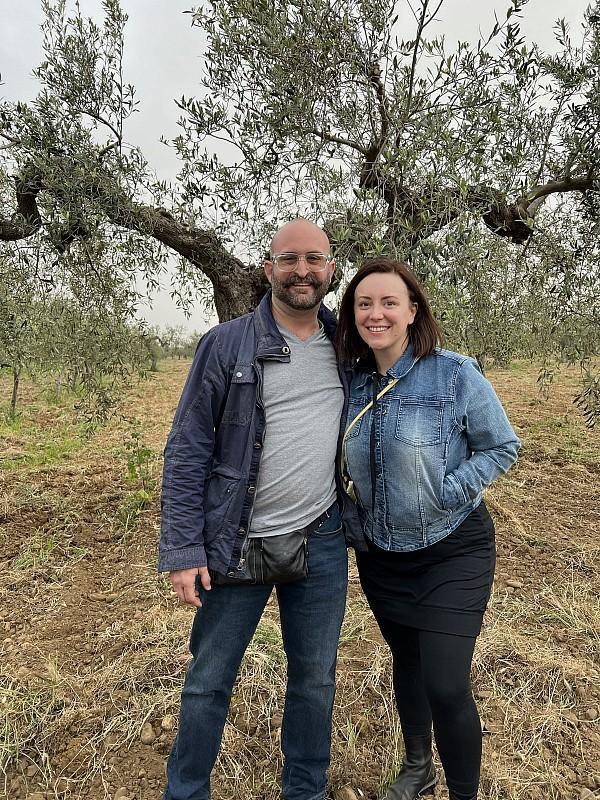 Sarah Palmeri and Nick Palmeri in front of a 400 year old olive tree at the Asaro Organic Farm in Castelvetrano, Sicily 