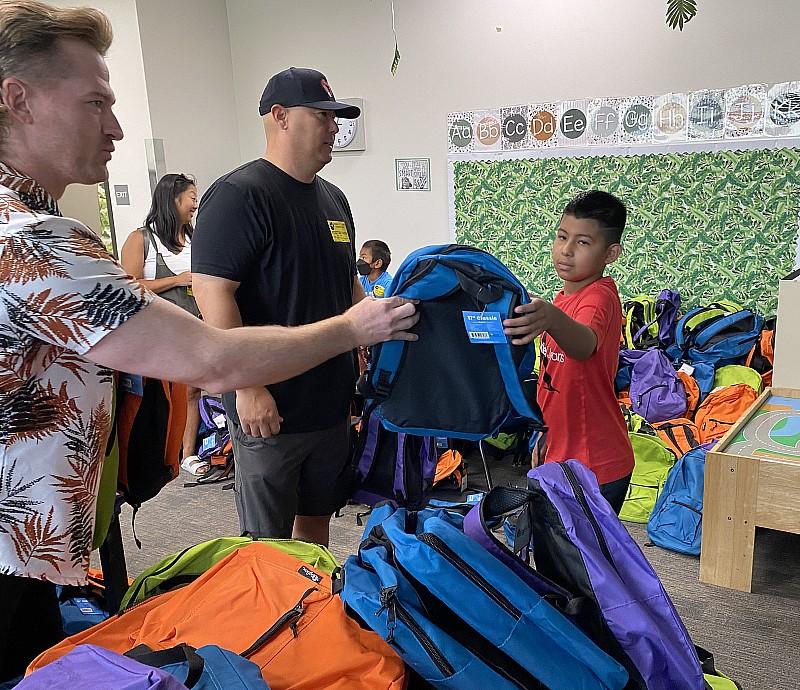 SAHARA Las Vegas team members distribute school supplies to Robert E. Lake Elementary School