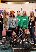 Volunteers From MONAT Global Build Bikes and Collect Handbags to Support Las Vegas Nonprofit Organizations