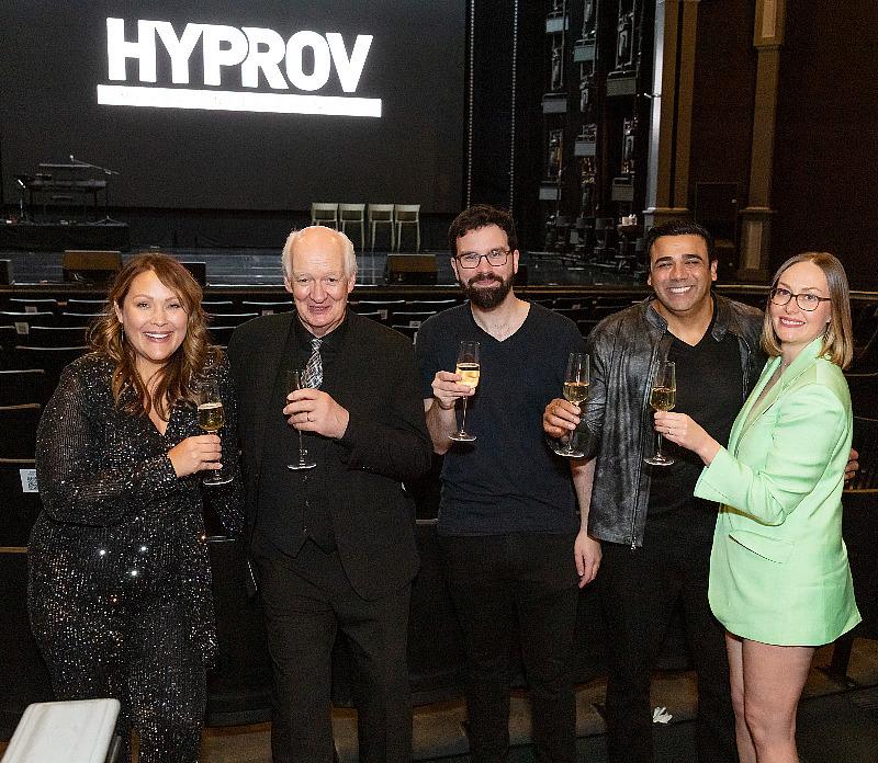 Amber Nash, Asad and Sarah Mecci, Colin Mochrie and John Hilsen celebrating with champagne toast at HYPROV Opening inside Harrah's Las Vegas