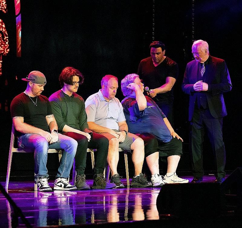 Asad Mecci and Colin Mochrie with volunteers onstage at HYPROV Opening Night inside Harrah's Las Vegas
