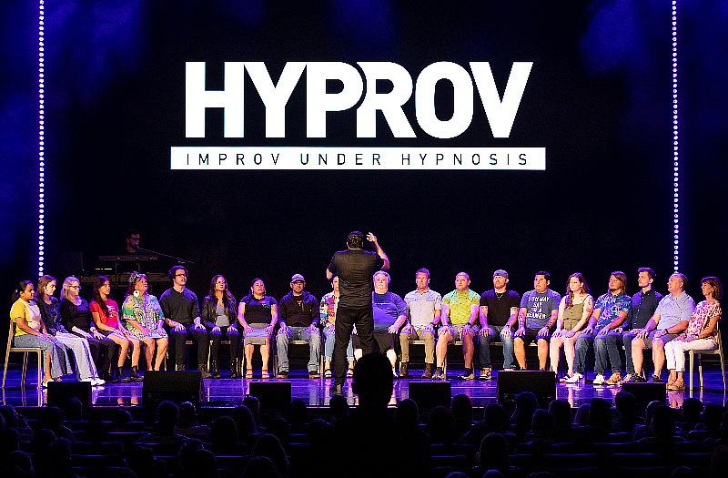 Asad Mecci with volunteers onstage at HYPROV Opening Night inside Harrah's Las Vegas