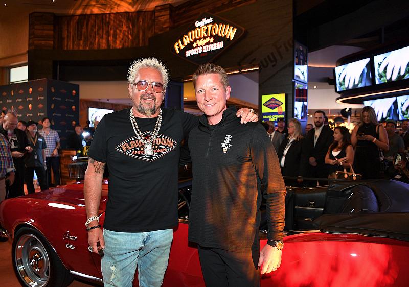 Guy Fieri poses with Jason Gregorec, Senior Vice President and General Manager of Horseshoe Las Vegas and the iconic 1968 Chevrolet Camaro from the hit television series. 