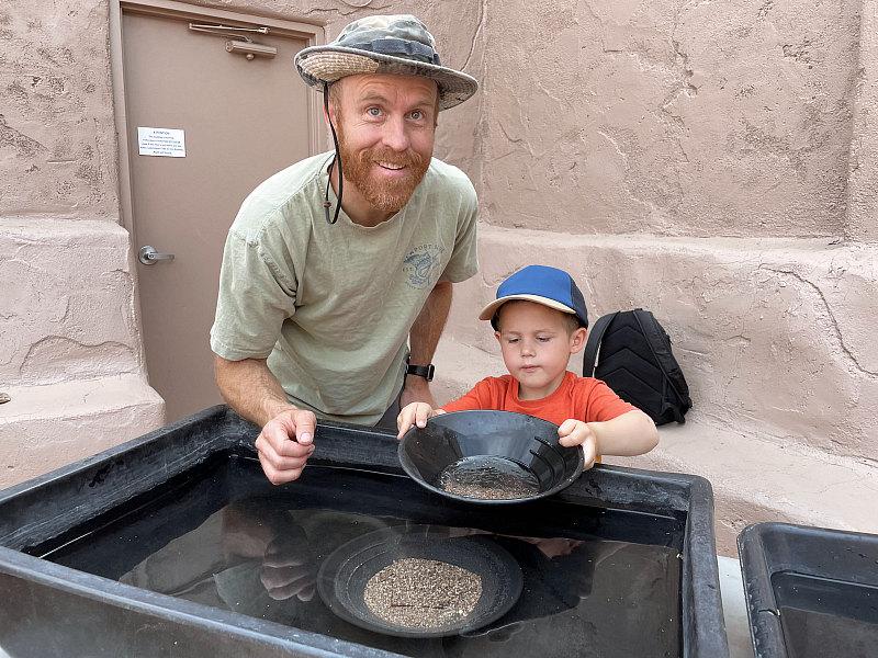 Father and son panning for gold