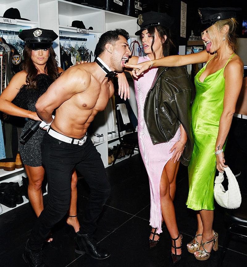 Bravolebrities (L to R) Malia White, Katie Flood and Casey Craig get cheeky with Chippendales Dancer Alejandro Rodriguez backstage at Rio All-Suite Hote & Casino in Las Vegas (Photo by Denise Truscello/Getty)